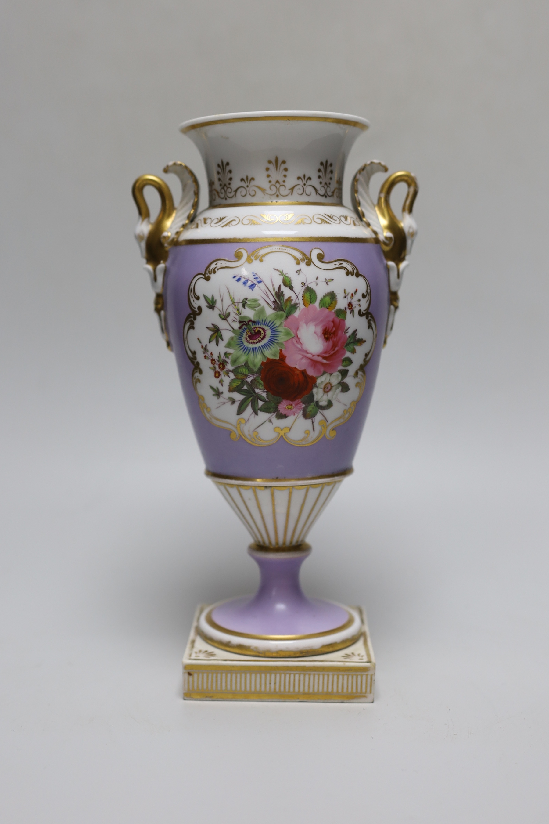 An English porcelain vase with swan handles, probably Chamberlains Worcester, painted with flowers on a lavender ground c.1820, 25.5cm tall